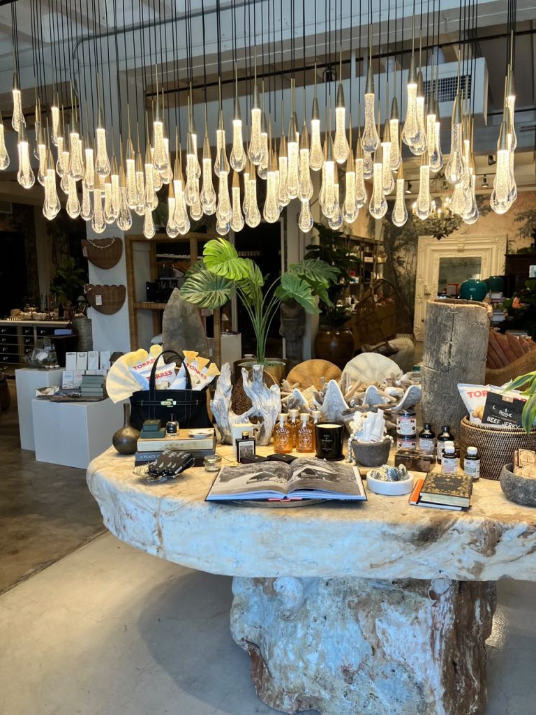 Interior of Gypsy Bungalow boutique in West Palm Beach, featuring curated home décor, decorative hanging lights, and unique gifts.